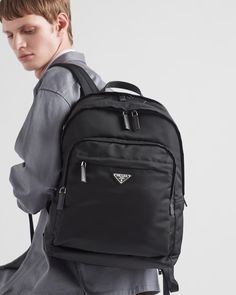 Black Re-nylon And Saffiano Leather Backpack | PRADA Luxury Nylon Bags With Logo Patch, Luxury Nylon Backpack With Zipper Closure, Luxury Backpack With Functional Pockets, Designer Nylon Backpack For Travel, Modern Travel Backpack With Logo Patch, Classic Nylon Business Backpack, Designer Black Nylon Backpack, Classic Nylon Backpack With Zipper Pocket, Luxury Nylon Backpack With Leather Trim