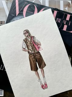 a drawing of a woman's outfit on top of magazines