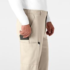 Flat front pant with deco stitching, generous utility, and stylized pockets that features ample storage. W1 distinctive silhouettes tailored for all shapes and sizes, W2 leading edge micro-fiber technology fabric, W3 functional utility using spacious pockets, multiple accessory loops creates superb organization. Mens Athletic Pants, Jockey Mens, Slim Fit Chino Pants, Fitted Dress Pants, Flat Front Pants, Slim Fit Chinos, Big Clothes, How To Hem Pants, Mens Cargo