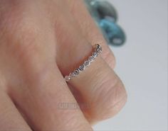 Sterling Silver CZ ring, half eternity - promise ring - simple ring, sweet ring - Womens - enhancer Top of Ring Height: 2.2mm Band Width: 1.5mm Shank Width: 1.6mm Stone Material: Clear Cubic Zirconia Stone Shape: Round Total Number of CZ Stones: 14 Stone Setting: Prong Metal: 925 Sterling Silver Plating: Rhodium plated Finish: High Polish Metal is solid 925 Sterling silver, High polished, with rhodium plating Email me if you have any questions. Promise Diamond Ring With Channel Set And Open Ring, Channel Set Diamond Open Ring For Promise, Channel Set Diamond Promise Ring, Channel Set Diamond Promise Ring, Open Design, Dainty Half Eternity Stackable Promise Rings, Adjustable Half Eternity Band Ring, White Gold Stackable Open Ring With Half Eternity, Sterling Silver Diamond Ring With Half Eternity Band, Sterling Silver Channel Set Stackable Rings