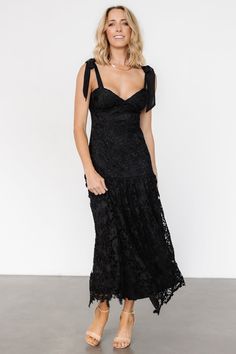 Timeless charm and modern details create a memorable look Black lace over lining Sweetheart neckline Padded bust Hidden zipper at back for closure Self-tie sleeve straps Single-tiered skirt Self and Lining: 100% Polyester Trina is 5'6, cup size 32D, size 2 and is wearing size S Lace Dress With Lace-up Back For Brunch, Lace Dress With Tie Back And Sweetheart Neckline, Chic Lace Dress With Lace-up Back, Chic Black Lace Dress With Sweetheart Neckline, Chic Lace Dresses With Lace-up Back, Lace Party Dress With Tie Back, Lace Midi Dress With Sweetheart Neckline For Night Out, Elegant Lace Dress With Lace-up Back, Chic Lace Dress With Sweetheart Neckline For Date Night