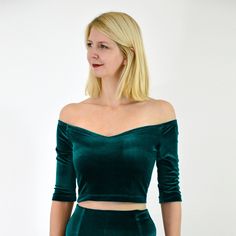 "Luxurious velour/stretch velvet bardot crop top, with an off-shoulder, décolletage neckline, elbow length sleeves and waist darts. Feel stylish in this simple and elegant velvet off shoulder crop top that bares the shoulders and offers a subtle flash of the midriff. This timeless design is made all the more special in this shimmering velvet, and is sure to become an essential part of your wardrobe.  Features a secret support lining for added comfort. WEAR FOR Create a sumptuous night-time look by wearing this top with slick high waisted trousers or a skirt; Especially good dressed up with a tulle skirt for Christmas parties and special occasions.  Alternatively, dress it down with denim for an elevated daytime look.   MADE FROM: Luxurious stretch velvet/velour. A beautifully draping fabri Christmas Party Tops, Velvet Dresses Outfit, Elegant Crop Top, Matching Skirt Set, Midriff Top, Bardot Crop Top, Velvet Party Dress, Blue Velvet Dress, Pencil Skirt Outfits