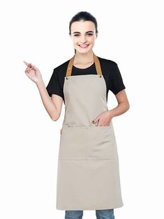 a woman wearing an apron and pointing to the side with her finger in one hand