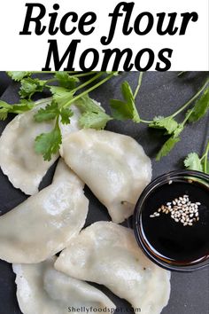 rice flour momos with dipping sauce and cilantro sprigs on the side