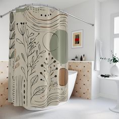 a bathroom with a bathtub, sink and shower curtain that has plants on it