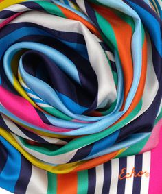 This versatile 100% silk scarf adds an accent in bold colors or striking neutrals. Tie it around the neck, wear it as a flowing head wrap, or even transform it into an eye-catching summer top. Dimensions: 13 in. x 72 in. Materials: 100% Silk Chic Multicolor Beach Scarves, Multicolor Silk Scarves, Chic Multicolor Silk Scarves, Multicolor Silk Scarf For Beach, Spring Multicolor Silk Scarf, Elegant Multicolor Beach Scarves, Trendy Multicolor Silk Scarf, Elegant Multicolor Beach Scarf, Elegant Multicolor Silk Scarf For The Beach