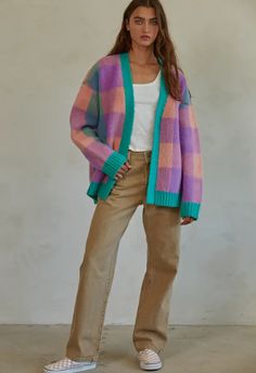 Made from a polyester knit blend, this cardigan boasts a playful gingham pattern and open front design. The long sleeves keep you warm while adding a touch of style to any outfit. Materials: 100% Polyester Quirky Cardigan, Sold Out Sign, Gingham Pattern, Denim Sweater, Day Of The Week, Front Design, Sales Gifts, Step Up, Shoe Collection