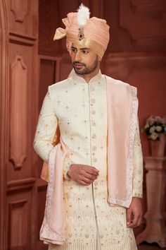 Step into elegance with our exquisite Pure Silk Sherwani, a timeless piece meticulously crafted for the modern man. This Sherwani boasts intricate embroidery, dazzling sequence work, and delicate handwork, adding a regal touch to your ensemble. Available in sizes 32 to 54, this Sherwani is tailored to perfection, ensuring a flawless fit for every gentleman. Elevate your style and make a statement at weddings, receptions, or any special occasion with this luxurious Sherwani.