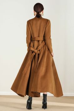 "This brown wool coat gives you the fall winter feels! Everything you need in a perfect midi wool coat is here. The wool coat to wear this season to work events, and out and about town....and now the search is over! It has been meticulously tailored with superior wool fabric that will keep you warm all season long. Every woman needs a wool coat in her wardrobe! DETAIL * Perfect Match with your favorite leggings, black slacks, denim jeans, etc * 50% wool blend, 50% fiber,nylon * Fully satiny lini Elegant Brown Wool Coat With Long Sleeves, Brown Double-breasted Wool Coat For Winter, Brown Single Breasted Wool Coat For Spring, Single Breasted Brown Wool Coat For Spring, Brown Single-breasted Wool Coat For Spring, Winter Brown Double-breasted Wool Coat, Fitted Brown Wool Coat For Fall, Brown Long Sleeve Wool Coat For Fall, Long Brown Wool Outerwear