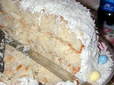 a close up of a cake on a plate with a knife