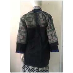 Vintage tribal White Hmong women tunic. Age is over 30 years and there are few places with repaired that you can see in the pictures. It is produced with hand and machine sawed,hand and machine stitched appliqué in cotton and used hand embroidered in cotton. It has pattern design on backside and fronts sleeve also, The black fabric is one kind of sateen fabric Measurement Length 73.5 cm Sleeve to sleeve 137 cm Chest 86 cm-92 cm Arm length 39 cm Armpit to armpit 52 cm Underarm width 34 cm Net Wei Traditional Winter Festival Tops, Women Tunic, Hand Stitch, Women Jacket, Womens Tunics, Measurement Length, Black Fabric, 30 Years, Hand Stitching