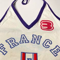 This Nostalgic France Halter Tank brings back 90s fashion with "FRANCE" lettering and a French shield emblem. The halter neck design is perfect for a retro aesthetic look Size:• S: Bust: 72cm/ 28.3 in, Length: 38cm/ 15.0 in• M: Bust: 76cm/ 29.9 in, Length: 39cm/ 15.4 in• L: Bust: 80cm/ 31.5 in, Length: 40cm/ 15.7 inMaterial: Polyester Retro Letter Print Tank Top, Retro Tops For Summer Sports Events, Retro Tops For Sports Events In Summer, Retro Summer Tops For Sports Events, Retro Letter Print Tank Top For Streetwear, 90s Style Summer Tops For College, Retro Stretch Tank Top, E Girl Clothes, Applique Top