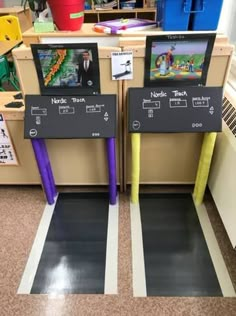 two video game machines sitting on top of a floor