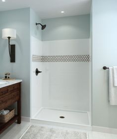 a bathroom with blue walls and white fixtures