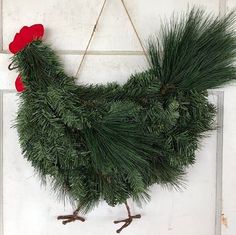 a christmas wreath hanging on the side of a door