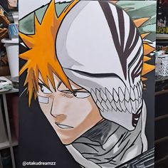 a drawing of an anime character with yellow hair and black eyes is on display in a shop