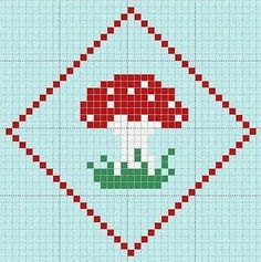 a cross stitch pattern with a red mushroom on it