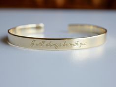 "Gold plated jewelry gives you the look and the style without the high price of pure gold. - Gold bracelet engraved with your chosen message. - The thickness of gold plating is around 0.5 microns - Text, coordinates, numbers or handwriting outside and inside the cuff - Up to 90 characters on each side - Approximately 0.25 inch wide (6.3mm), 6.3 inch long (16cm) - Laser engraved - the engraving is burned into the material using a laser beam. Size This is the length of the metal, not including the Gold Engraved Cuff Bracelet As A Gift, Gold Engraved Cuff Bracelet For Gift, Adjustable Gold Bangle With Engraving Option, Engraved Gold Cuff Bracelet As Gift, Elegant Gold Hand Stamped Bracelets, Gold Cuff Bracelet With Engraving Option, Gold Bangle Jewelry With Engraving Option, Engraved Gold Bangle Bracelet As A Gift, Engraved Gold Bangle Bracelet For Gift