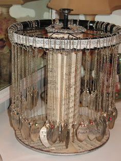 a table topped with lots of silverware next to a mirror