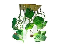 a chandelier with green leaves hanging from it's sides