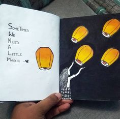 someone is holding up a book with pictures of yellow lanterns in the sky and writing some times we need a little magic