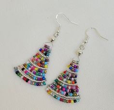 Colorful Creations: Handmade Multicolored Dangle Earrings - Etsy Multicolor Dangle Beaded Earrings For Celebrations, Multicolor Beaded Drop Earrings For Celebration, Multicolor Beaded Earrings For Celebration, Handmade Multicolor Earrings For Celebration, Multicolor Dangling Beads Earrings For Celebration, Elegant Multicolor Beaded Earrings For Festive Occasions, Festive Multicolor Beaded Earrings With Ear Wire, Multicolor Wire Wrapped Drop Earrings, Multicolor Wire Wrapped Dangle Beaded Earrings