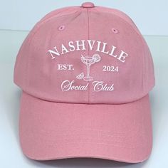 a pink hat with the words nashville estr and a cocktail glass on it's front