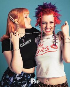 two young women with red hair and piercings