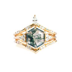 Our stunning ring set, featuring Moss Agate and White Diamonds, is a unique choice for your engagement. The hexagon-cut Moss Agate showcases its intriguing nature beautifully, while the bands complement its beauty in an eye-catching way. As the original jewelry designers to incorporate moss agate into geometric, one-of-a-kind pieces, we pride ourselves on our innovation and quality. Be cautious of other designers who use moss agate, as their designs often imitate our bestsellers and fail to meet our high standards of production and authentication. Tarnish proof Water proof Sleep / Nap proof Safe for sensitive skin Wear it while working out &showering Designed to wear 24/7 If there is no stock, the product will take 60 days to produce Please leave your usual email address and phone number f Moss Rings, Green Agate Ring, Ring Upgrade, Sterling Silver Nose Rings, Gemstone Earrings Gold, Silver Nose Ring, Agate Engagement Ring, Diamond Ring Set, Moss Agate Ring