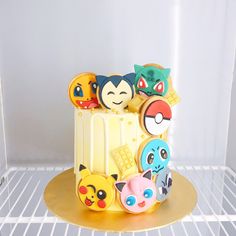 a pokemon themed cake sitting on top of a refrigerator