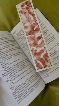 an open book with bacon strips sticking out of it