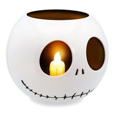 a white halloween ball with a lit candle inside