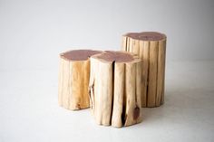 three pieces of wood sitting on top of each other