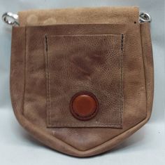 this pouch is great for motorcycle riding, cosplay, or larp. this pouch is 6 inches wide at the opening 7 inches at the widest and 7 inches tall with a 2 inch wide gusset, and has a small pocket with a magnetic closer. All my products are hand made in the USA and have a 5 year limited warranty against manufacturer defect Outdoor Leather Belt Bag With Belt Loops, Cross Belt, Motorcycle Riding, Veg Tan Leather, Celtic Cross, Kilt, Larp, Saddle Bags, Tan Leather