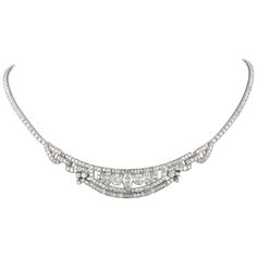 Stunning vintage Art Deco style diamond high jewelry necklace, centered with a marques diamonds. Approximately 10.80 carats of round, marquess, and baguette diamonds. Approximately G/H color and VS clarity. Platinum. Accommodated with an up-to-date appraisal by a GIA G.G. once purchased, upon request. Please contact us with any questions. Item Number N6429 Diamond Pendant Necklace Antique, Luxury Filigree Art Deco Necklace, Diamond High Jewelry, High Jewelry Necklace, Art Deco Diamond Jewelry, Vintage Diamond Necklace, Black Gold Necklace, Art Deco Pendant Necklace, Art Deco Jewelry Vintage