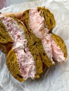 there is a sandwich with pink frosting on it