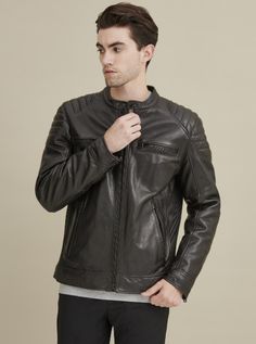 Shell: genuine leather Body Lining: 100% polyester; Sleeve Lining: 100% polyester Filler: 100% polyester Zipper placket with two button snap tab collar Quilted shoulder stitching Ribbed sides Zippered cuffs; banded hem and cuffs Business Biker Jacket With Snap Buttons And Long Sleeves, Business Biker Jacket With Snap Buttons, Classic Winter Biker Jacket With Snap Buttons, Business Leather Jacket With Padded Collar, Classic Long Sleeve Biker Jacket With Padded Collar, Leather Outerwear With Zip Cuffs For Fall, Winter Leather Biker Jacket With Zip Cuffs, Business Outerwear With Zip Cuffs For Fall, Fitted Leather Outerwear With Zip Cuffs