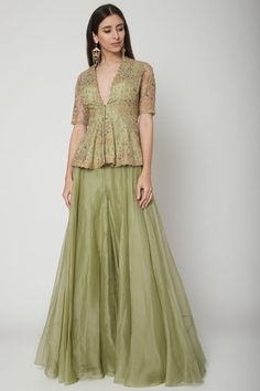 Olive Green Embroidered Peplum Top With Sharara Pants Design by Ridhi Mehra at Pernia's Pop Up Shop 2024 Peplum Style Suit, Flared Pants Outfit Indian, Plazzo Kurti Design, Netted Kurti Designs, Net Sharara Designs, Plazzo With Top Outfit, Plazzo Suit Design, Organza Dress Indian Kurti, Peplum Top With Sharara