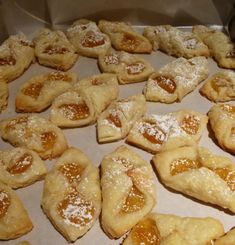 small pastries are arranged on a baking sheet