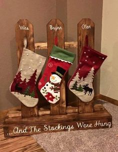 an image of christmas stockings on display in a wooden frame with the words and sayings below them