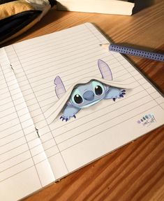 a notebook with a cut out of a cartoon character