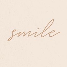 the word smile written in cursive writing on a white background with brown ink