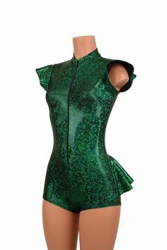 a mannequin with green sequins on it's chest and shoulders