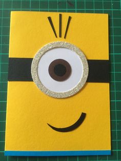 a card made to look like a minion with an eyeball on the front