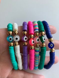 Perfect for summer, these heishi bracelets can be made with or without the evil eye. Evil eye colours are as pictured, if you would like a mix/match colour, please send me a message. All evil eye bracelets, come cushioned with 14k gold filled beads. Evil Eye Clay, Eye Clay, Make Clay Beads, Eye Colours, Heishi Bracelets, Fork Jewelry, Fimo Beads, Micro Mosaic Jewelry, Homemade Bracelets