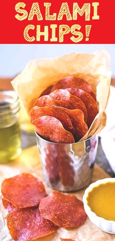 this is an image of salami chips in a tin with mustard and ketchup