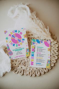 two flyers sitting on top of a doily next to a white cloth and some yarn