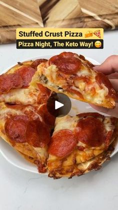 someone cutting into a pepperoni pizza on a white plate with the words stuffed crust pizza