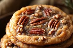 three pecan cookies stacked on top of each other