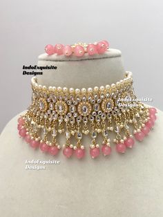 Kundan choker set comes with beautiful Jhumki earrings and tikka /Kundan Polki Necklace/Reception/Wedding/bridal jewelry/ Indian jewelry /Kundan Jewelry/Pink  All items are shipped from Brampton, Ontario, Canada. If you need your item by a certain day, please reach out to us for express delivery option before placing the order so that we can update the shipping for you. Standard shipping/delivery timeline Below are the estimated delivery times after the order is shipped/dispatched.  ---> USA delivery timeline * 4-8 business days to major urban centers in USA. It may take 2-3 days extra to remote locations ---> Canada delivery timeline  * 2-3 business days - GTA  & Montreal  * 2-4  business days - Rest of Ontario/Quebec * 4-8 business days-  Rest of Canada (Please consider 1-2 extra busines Pink Kundan Necklace With Meenakari For Reception, Pink Bollywood Chandbali Bridal Sets, Pink Kundan Chandbali Bridal Set, Pink Kundan Bridal Sets For Festivals, Heavy Pink Kundan Necklace For Reception, Bollywood Style Pink Jewelry Sets For Reception, Pink Temple Jewelry Choker For Wedding, Pink Bollywood Bridal Set, Bollywood Pink Choker For Diwali